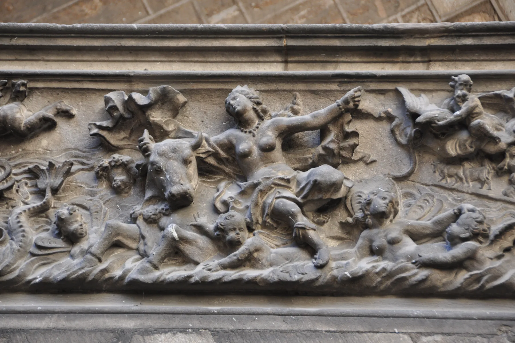A relief carved on the staircase balustrade showing the Abduction of Europa, with a bull and sea creatures